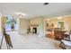 Bright living room with white brick fireplace and large windows at 3265 Tulip Dr, Indianapolis, IN 46227