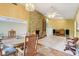 Open concept living room and dining area with stone fireplace at 3265 Tulip Dr, Indianapolis, IN 46227