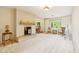 Spacious living room with fireplace, plush carpet, and serene natural light at 3265 Tulip Dr, Indianapolis, IN 46227