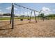 A playground with swings and climbing area, designed for children to play and socialize in a safe community space at 3333 Godby Dr, Sheridan, IN 46069