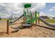A modern playground featuring multiple slides, climbing structures, and a swing set, perfect for Gathering fun at 3333 Godby Dr, Sheridan, IN 46069