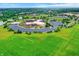 Aerial view showcasing a school complex, sports fields and lush green surroundings at 3345 Kilkenny Cir, Carmel, IN 46032
