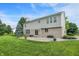 Spacious backyard patio with views, complemented by a well-maintained lawn and landscaped gardens at 3345 Kilkenny Cir, Carmel, IN 46032