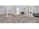 Finished basement space with french doors, wood floors, and staircase to upstairs at 3345 Kilkenny Cir, Carmel, IN 46032