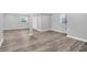 Finished basement features two windows, wood flooring, and a white closet door at 3345 Kilkenny Cir, Carmel, IN 46032
