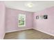 Bedroom with wood floor and window with view to exterior at 3345 Kilkenny Cir, Carmel, IN 46032