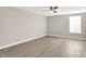 Bright bedroom features hardwood floors, ceiling fan and plenty of natural light at 3345 Kilkenny Cir, Carmel, IN 46032