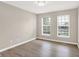 Bright bedroom with wood floors and double windows at 3345 Kilkenny Cir, Carmel, IN 46032
