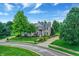 Beautiful two-story home featuring mature trees, manicured lawns, and a classic architectural design at 3345 Kilkenny Cir, Carmel, IN 46032