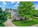 Well-maintained home with a two-car garage and a neatly landscaped yard. A perfect Gathering home at 3345 Kilkenny Cir, Carmel, IN 46032