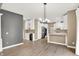 Open-concept kitchen features white cabinets and stainless steel appliances at 3345 Kilkenny Cir, Carmel, IN 46032