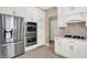 Close up of gourmet kitchen featuring stainless steel appliances and white cabinetry at 3345 Kilkenny Cir, Carmel, IN 46032