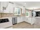 Bright kitchen featuring stainless steel appliances, stone countertops and tiled backsplash at 3345 Kilkenny Cir, Carmel, IN 46032