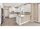 Bright kitchen featuring white cabinetry, stone countertops and backsplash at 3345 Kilkenny Cir, Carmel, IN 46032