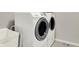 Modern laundry room featuring white front load washer and dryer at 3345 Kilkenny Cir, Carmel, IN 46032