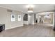 Spacious living room with light hardwood floors leading into a bright kitchen at 3345 Kilkenny Cir, Carmel, IN 46032