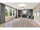 Spacious living room featuring a fireplace, built-in shelving, and large windows offering natural light and nice views at 3345 Kilkenny Cir, Carmel, IN 46032