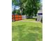 Large, well-maintained backyard featuring a wooden fence, lush grass, and plenty of space at 3464 N Bancroft St, Indianapolis, IN 46218