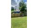 Spacious fenced backyard with a lush green lawn, offering ample space for outdoor activities at 3464 N Bancroft St, Indianapolis, IN 46218