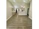 Spacious open-concept living space with sleek floors and a clear view into the kitchen at 3464 N Bancroft St, Indianapolis, IN 46218