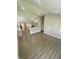 Open-concept living area features modern floors, flowing seamlessly into the kitchen and dining areas at 3464 N Bancroft St, Indianapolis, IN 46218
