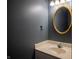 Well-lit bathroom with a neutral color scheme and updated mirror at 3474 Glen Abbe Ct, Carmel, IN 46032