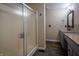 Bathroom featuring an enclosed shower, wood look tile flooring, granite countertop, and neutral paint at 3474 Glen Abbe Ct, Carmel, IN 46032