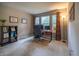 This neutral bedroom is set up as an office with large windows and a modern desk at 3474 Glen Abbe Ct, Carmel, IN 46032