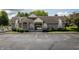 Community clubhouse with ample parking, stone facade and manicured landscape at 3474 Glen Abbe Ct, Carmel, IN 46032
