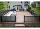 Large wooden deck with black railing and space for outdoor seating and entertaining at 3474 Glen Abbe Ct, Carmel, IN 46032
