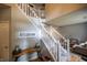 Inviting foyer with staircase, console table, and decorative sign at 3474 Glen Abbe Ct, Carmel, IN 46032
