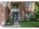 Close-up of brick home's front door with large arched window above at 3474 Glen Abbe Ct, Carmel, IN 46032