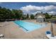 Community swimming pool with lounge chairs and tables offers a relaxing gathering place for residents at 3474 Glen Abbe Ct, Carmel, IN 46032
