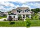 Lovely home boasts professional landscaping, a covered front porch, and a well-maintained lawn at 3606 Evergreen Way, Zionsville, IN 46077