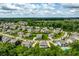 Aerial view showcasing a sprawling neighborhood with well-maintained homes and lush green spaces at 3606 Evergreen Way, Zionsville, IN 46077