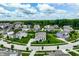 Neighborhood aerial view showcasing tree-lined streets and well-maintained homes in a suburban community at 3606 Evergreen Way, Zionsville, IN 46077