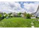 Spacious backyard featuring a lush lawn, charming patio with a pergola, and a privacy fence at 3606 Evergreen Way, Zionsville, IN 46077