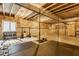Unfinished basement featuring exposed rafters, concrete walls and floors, and a dedicated workout area at 3606 Evergreen Way, Zionsville, IN 46077