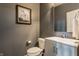Stylish half bathroom with modern vanity, fixtures, and neutral color palette at 3606 Evergreen Way, Zionsville, IN 46077