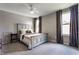Cozy bedroom with a neutral color scheme, carpet, and an overhead ceiling fan at 3606 Evergreen Way, Zionsville, IN 46077
