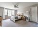 Well-lit bedroom with a large window and a wooden-framed bed at 3606 Evergreen Way, Zionsville, IN 46077