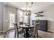 Cozy dining room with a stylish chandelier, comfortable seating, and natural light, creating an inviting atmosphere at 3606 Evergreen Way, Zionsville, IN 46077