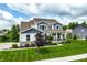 Beautiful home with a manicured lawn, landscaping, and inviting curb appeal at 3606 Evergreen Way, Zionsville, IN 46077