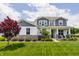 Charming two-story home featuring manicured lawn, landscaping, and a welcoming front porch at 3606 Evergreen Way, Zionsville, IN 46077