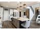 Spacious kitchen featuring a large island with seating, stainless steel appliances, and a functional layout for cooking at 3606 Evergreen Way, Zionsville, IN 46077