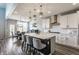 Modern kitchen with a large island, granite countertops, and stainless steel appliances, perfect for cooking and entertaining at 3606 Evergreen Way, Zionsville, IN 46077