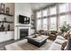 Bright living room featuring a fireplace and plenty of seating at 3606 Evergreen Way, Zionsville, IN 46077