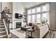 Spacious living room with a fireplace, high ceilings, and ample natural light at 3606 Evergreen Way, Zionsville, IN 46077