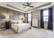 Serene main bedroom with tray ceiling, two windows, and neutral decor at 3606 Evergreen Way, Zionsville, IN 46077
