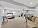 Finished basement with a play area, bedroom space, and seating area at 3740 Weather Stone Xing, Zionsville, IN 46077